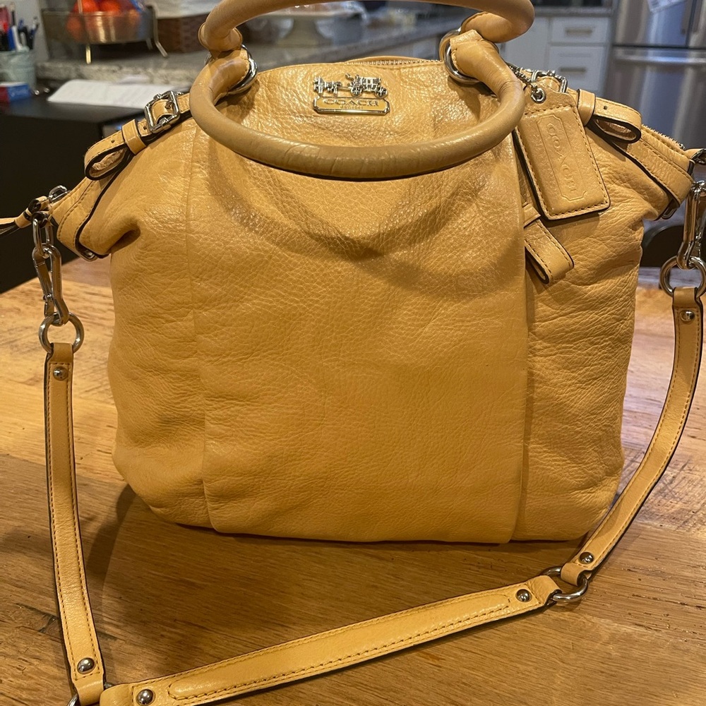 Beautiful Coach carryall. Chrome detail. Hidden front pocket. Great condition.
